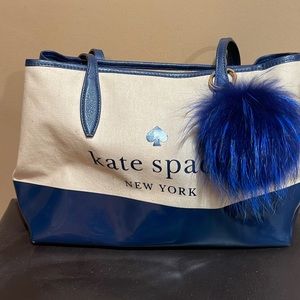 Authentic Kate Spade with canvas and patten. Also included real fox fur key ring